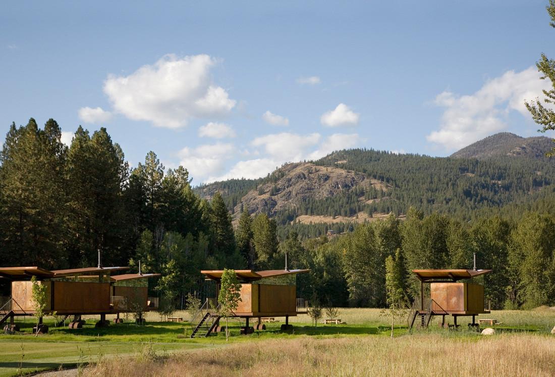 Rolling huts sit lightly on the site, a flood plain meadow in an alpine river valley. The owner purchased the ...